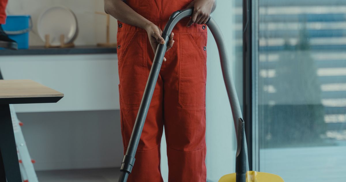 Professional commercial cleaning team preparing equipment for a janitorial services bid
