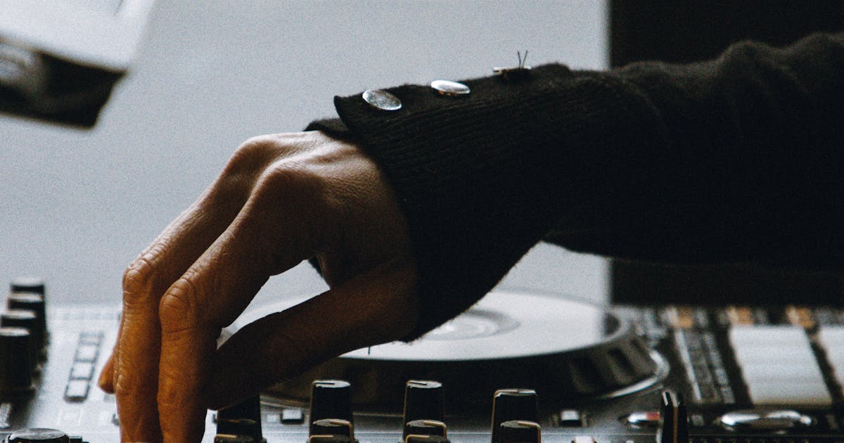 Professional DJ setup at a wedding or event with sound equipment and lighting