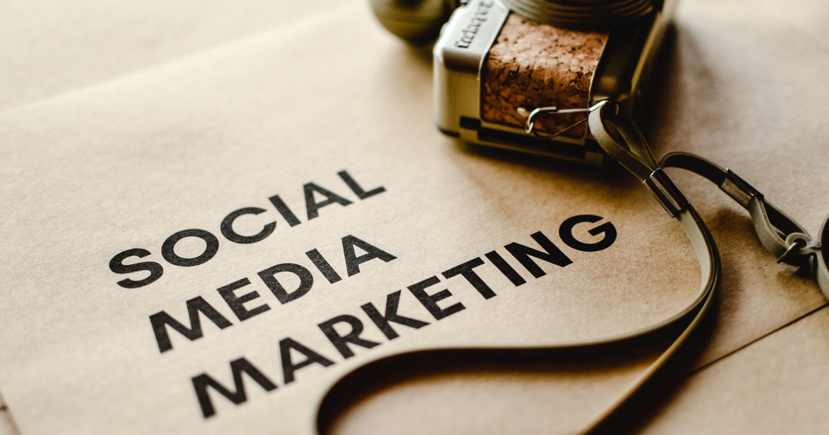 Small business owner using a smartphone to manage social media marketing
